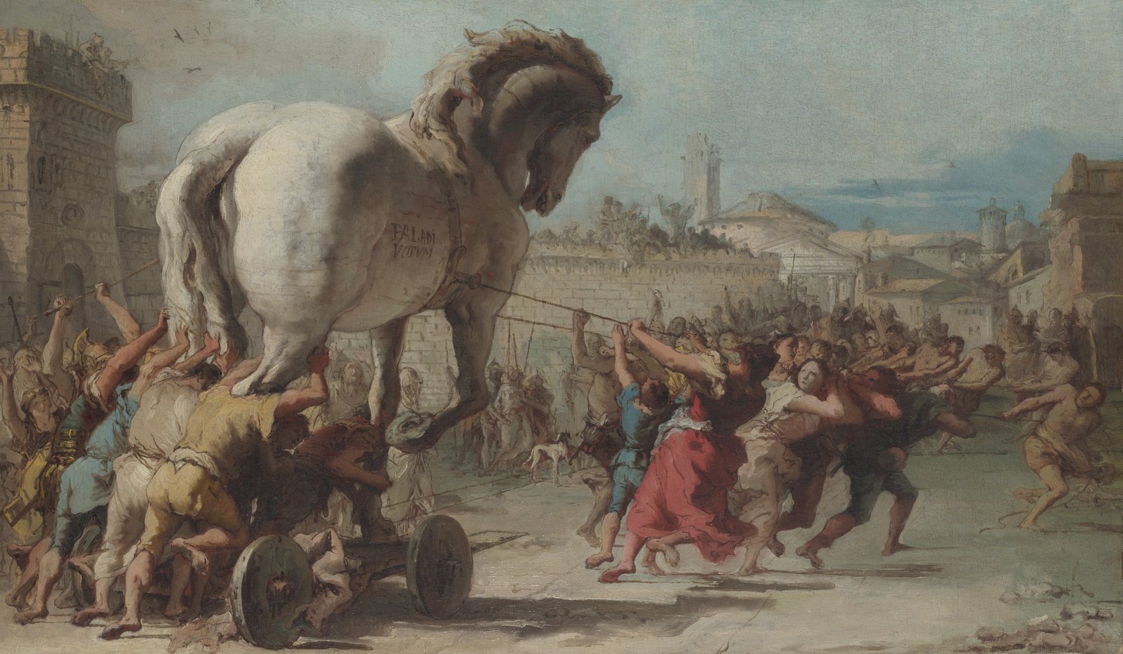 A crowd hauling the wooden horse toward the walls of Troy.
